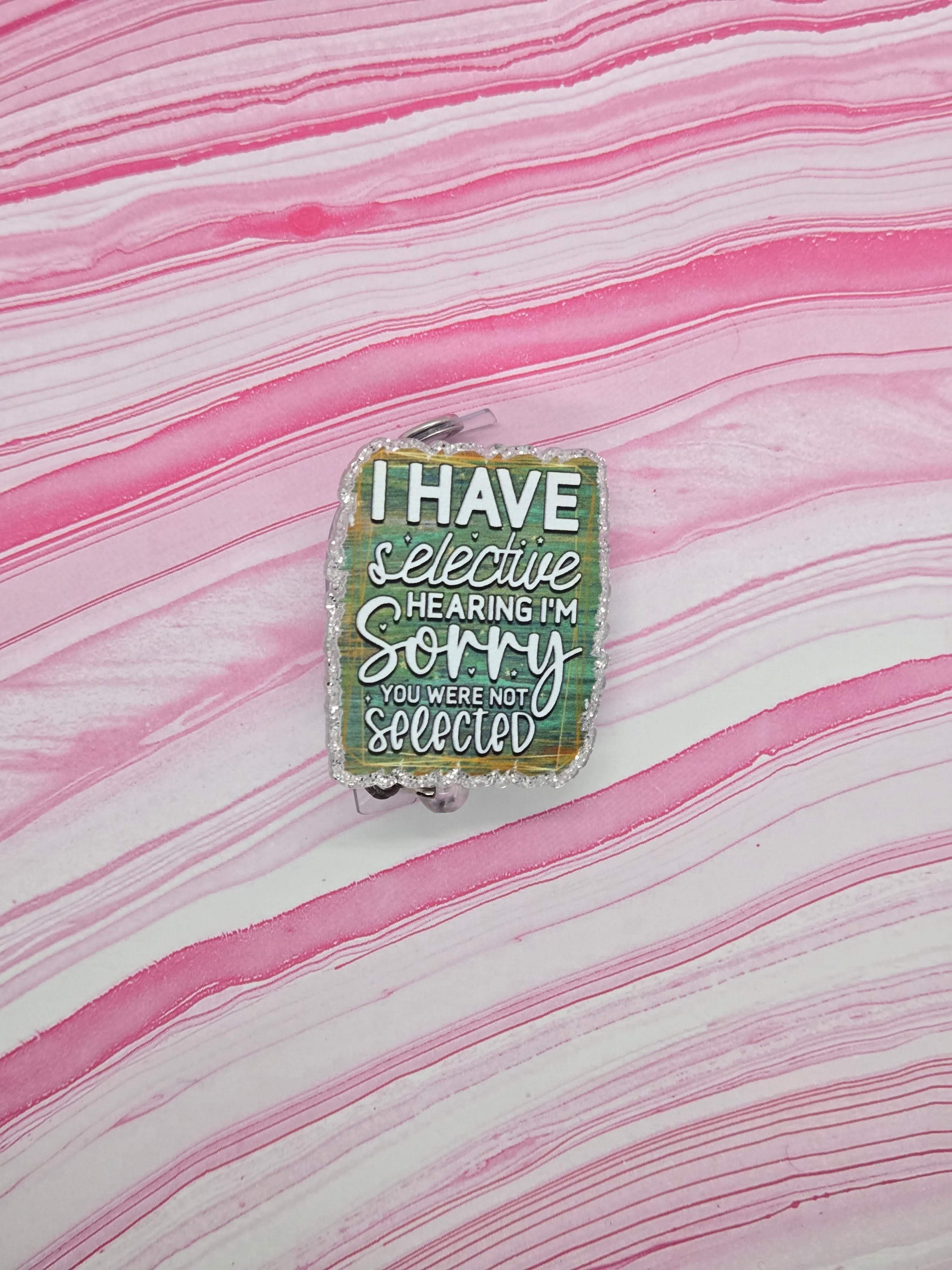 Badge reel selective hearing